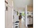 Bright entryway with shoe storage and a view into the living area and kitchen at 12760 Indian Rocks Rd # 910, Largo, FL 33774