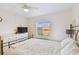 Bright bedroom with a comfortable bed, dresser, and large window at 12760 Indian Rocks Rd # 910, Largo, FL 33774