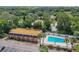 Community pool with surrounding lounge chairs at 12760 Indian Rocks Rd # 910, Largo, FL 33774