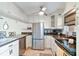 Modern kitchen with stainless steel appliances and L-shaped design at 12760 Indian Rocks Rd # 910, Largo, FL 33774