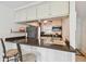 Kitchen with breakfast bar seating and dark countertops at 12760 Indian Rocks Rd # 910, Largo, FL 33774