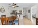 Bright dining area with a wood table and four chairs, kitchen partially visible at 12760 Indian Rocks Rd # 910, Largo, FL 33774