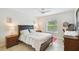 Bedroom with a comfortable bed and plenty of sunlight at 12760 Indian Rocks Rd # 910, Largo, FL 33774