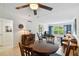 Dining area with a round table and chairs, near living room at 12760 Indian Rocks Rd # 910, Largo, FL 33774