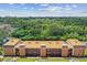 Aerial view of an apartment building with lush green surroundings at 12760 Indian Rocks Rd # 910, Largo, FL 33774