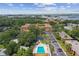 Community pool with surrounding lounge chairs and trees at 12760 Indian Rocks Rd # 910, Largo, FL 33774