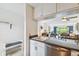 Kitchen with a breakfast bar and view into the living room at 12760 Indian Rocks Rd # 910, Largo, FL 33774