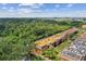 Aerial view of apartment buildings near water with green surroundings at 12760 Indian Rocks Rd # 910, Largo, FL 33774