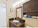 Bathroom with vanity, toilet and dark wood cabinets at 12760 Indian Rocks Rd # 910, Largo, FL 33774