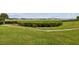 Landscaped lawn with walkway offering scenic water views at 12760 Indian Rocks Rd # 910, Largo, FL 33774