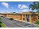 Building exterior showcasing parking and landscaping at 12760 Indian Rocks Rd # 910, Largo, FL 33774