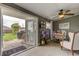 Home office with desk, chair, and access to backyard patio at 2219 Beach S Blvd, Gulfport, FL 33707