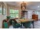 Charming dining area with a wooden table and teal chairs at 2219 Beach S Blvd, Gulfport, FL 33707