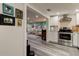 Open concept kitchen with stainless steel appliances and white cabinets at 2219 Beach S Blvd, Gulfport, FL 33707