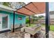 Covered patio features wicker furniture and a tranquil setting at 2219 Beach S Blvd, Gulfport, FL 33707
