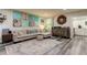 Living room with L-shaped sofa, eclectic decor, and view of kitchen at 2219 Beach S Blvd, Gulfport, FL 33707