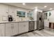 Modern kitchen features white cabinets, stainless steel appliances, and a spacious layout at 2219 Beach S Blvd, Gulfport, FL 33707