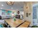 Bright living room features a large sectional sofa, dining table, and an open floor plan at 2219 Beach S Blvd, Gulfport, FL 33707