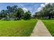Picturesque community park with grassy areas, trees, and walking paths at 2219 Beach S Blvd, Gulfport, FL 33707