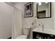 Clean bathroom with a walk-in shower and modern vanity at 2219 Beach S Blvd, Gulfport, FL 33707