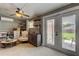 Bright sunroom with French doors leading to backyard at 2219 Beach S Blvd, Gulfport, FL 33707