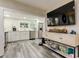 Modern kitchen with white cabinets, stainless steel appliances, and wood-look flooring at 2219 Beach S Blvd, Gulfport, FL 33707