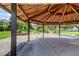 Wooden gazebo offering shade and a peaceful park view at 2219 Beach S Blvd, Gulfport, FL 33707