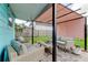 Relaxing backyard patio with covered seating area and brick pavers at 2219 Beach S Blvd, Gulfport, FL 33707
