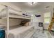 Nautical-themed bedroom with a bunk bed and built-in drawers at 2219 Beach S Blvd, Gulfport, FL 33707