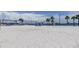 Beach volleyball courts with palm trees at 2219 Beach S Blvd, Gulfport, FL 33707