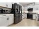 Stainless steel appliances and white shaker cabinets in this kitchen at 4359 70Th Street E Cir, Palmetto, FL 34221