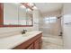 Clean bathroom, featuring a shower/tub combo and wood vanity at 6605 Pointe West Blvd, Bradenton, FL 34209