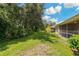 Landscaped backyard with lush greenery and privacy at 34802 Double Eagle Ct, Zephyrhills, FL 33541