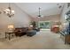 Living area with leather seating, a ceiling fan, and access to a patio at 34802 Double Eagle Ct, Zephyrhills, FL 33541