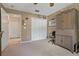 Bright bedroom with double door closet and view of hallway at 34802 Double Eagle Ct, Zephyrhills, FL 33541