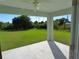 Covered patio overlooking a spacious backyard at 10437 Grail Ave, Englewood, FL 34224