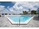 Inviting community pool with plenty of lounge chairs at 11590 Shipwatch Dr # 548, Largo, FL 33774