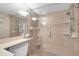 Large walk-in shower with glass enclosure and tile surround at 11590 Shipwatch Dr # 548, Largo, FL 33774