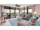 Spacious living room with light flooring, comfy seating, and water views at 11590 Shipwatch Dr # 548, Largo, FL 33774