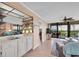 Wet bar with white cabinets and mirrored backsplash at 11590 Shipwatch Dr # 548, Largo, FL 33774