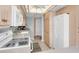 Bright kitchen with light wood cabinets, and white appliances at 11590 Shipwatch Dr # 548, Largo, FL 33774
