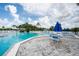 Relaxing community pool with patio furniture at 11590 Shipwatch Dr # 548, Largo, FL 33774