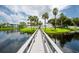 Scenic walkway over water to community green space at 11590 Shipwatch Dr # 548, Largo, FL 33774