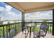 Relaxing balcony with patio furniture and water views at 11590 Shipwatch Dr # 548, Largo, FL 33774