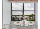 Cozy breakfast nook with a small table and chairs overlooking a scenic view at 11590 Shipwatch Dr # 548, Largo, FL 33774