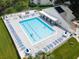Inviting community pool with plenty of lounge chairs at 11590 Shipwatch Dr # 548, Largo, FL 33774