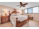 Bright bedroom with king-size bed and water views at 11590 Shipwatch Dr # 548, Largo, FL 33774