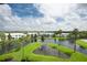Serene pond with a view of community buildings at 11590 Shipwatch Dr # 548, Largo, FL 33774