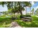 Relaxing picnic area by pond with benches at 11590 Shipwatch Dr # 548, Largo, FL 33774