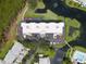 Top-down view of building, parking, and landscaping at 11590 Shipwatch Dr # 548, Largo, FL 33774